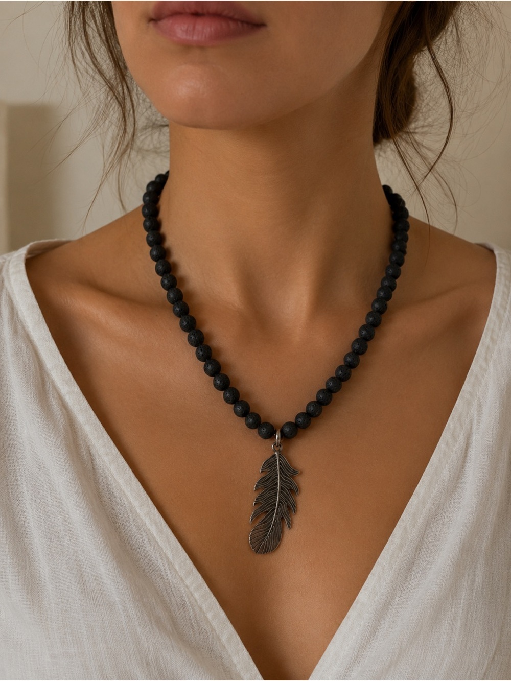 Black Lava Bead Necklace with Feather Pendant